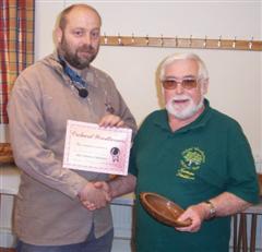 The monthly winner Norman Smithers receiving certificate from Colin Simpson